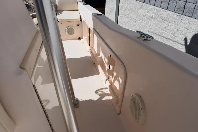 Slide: The Image of 2010 Grady-White Fisherman 209 boat interior, featuring seating and storage compartments. - 14