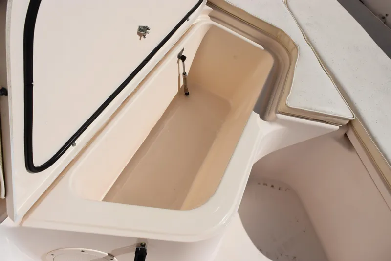 Slide: The Image of 2010 Grady-White Fisherman 209 storage compartment, open and empty, showcasing interior space. - 16