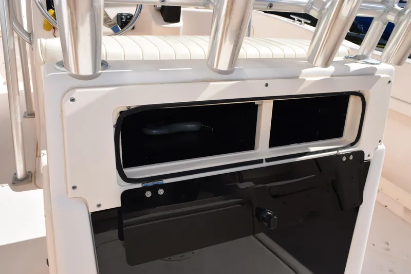 Slide: The Image of Grady-White Fisherman 209 console storage, 2010 model, featuring rod holders and seating. - 20