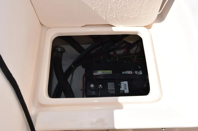 Slide: The Image of Battery compartment of 2010 Grady-White Fisherman 209 boat, showing wiring and connections. - 23