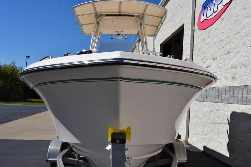 Slide: The Image of 2010 Grady-White Fisherman 209 boat on trailer, parked outside a building. - 4