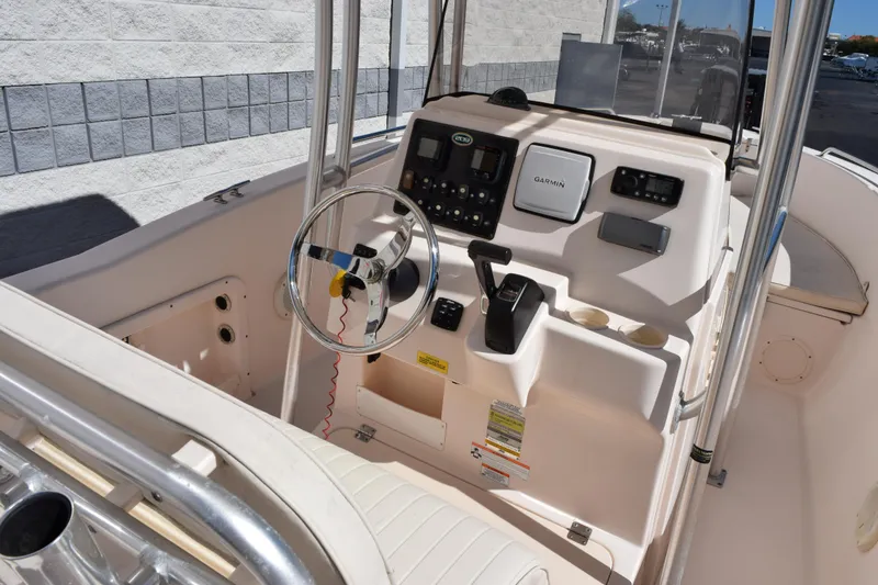 Slide: The Image of 2010 Grady-White Fisherman 209 boat console with steering wheel and Garmin navigation system. - 8