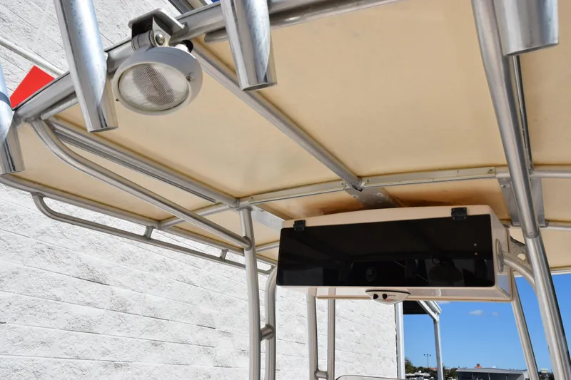 Slide: The Image of T-top of 2010 Grady-White Fisherman 209 boat with mounted light and electronics box. - 9