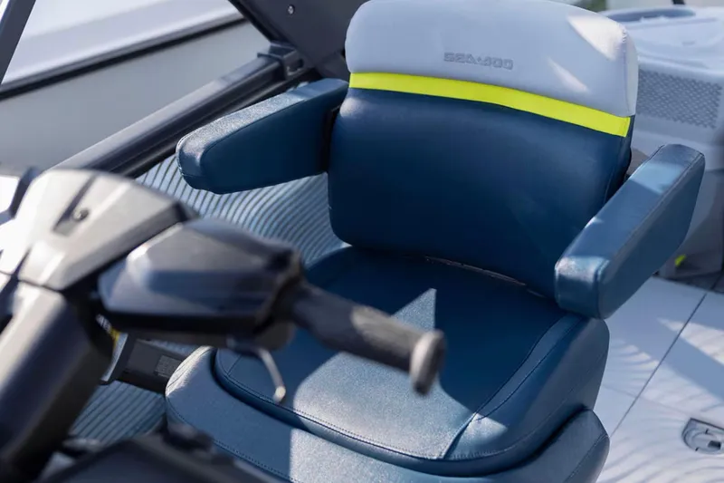 Slide: The Image of 2025 Sea-Doo Switch Cruise Limited 21 seat and steering detail, featuring blue and white upholstery. - 5