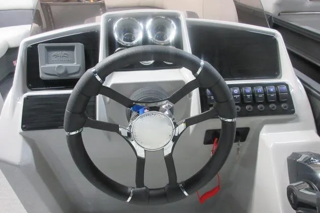 Slide: The Image of Steering console of 2026 Sylvan Mirage 822 CLZ pontoon boat with modern controls. - 3