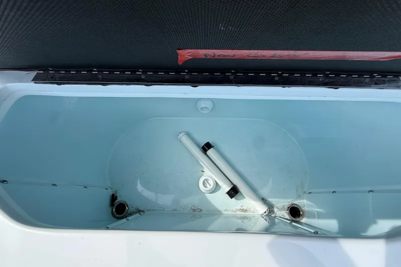 Slide: The Image of Livewell of 2018 Yellowfin 32 Offshore boat, featuring clean interior and drainage system. - 101