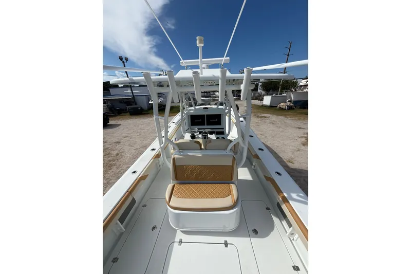 Slide: The Image of 2018 Yellowfin 32 Offshore boat interior with seating and navigation equipment. - 15
