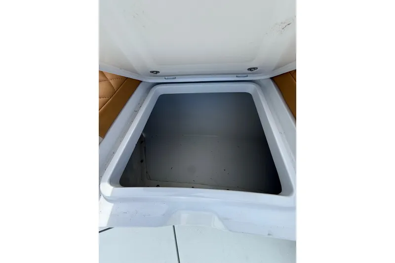 Slide: The Image of Open storage compartment on 2018 Yellowfin 32 Offshore boat. - 22