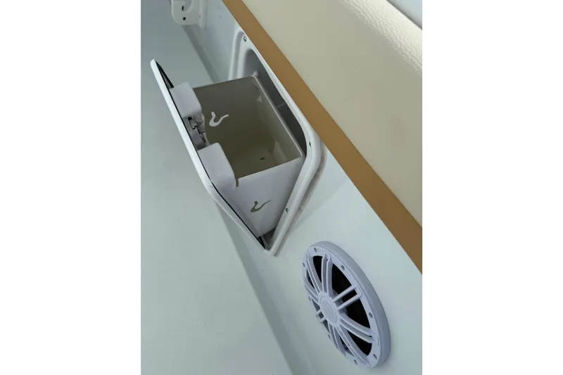 Slide: The Image of 2018 Yellowfin 32 Offshore boat storage compartment and speaker detail. - 30