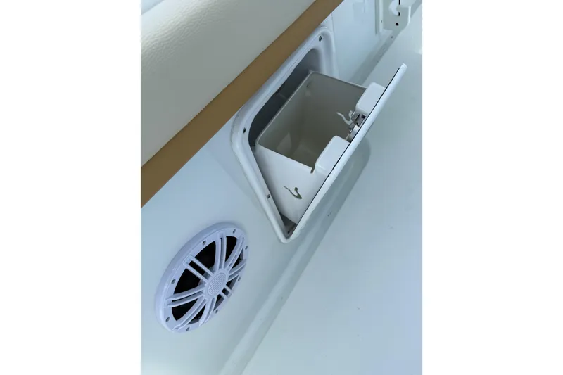 Slide: The Image of 2018 Yellowfin 32 Offshore boat storage compartment and speaker detail. - 32