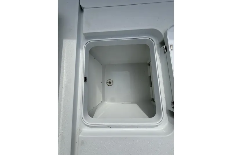 Slide: The Image of Open storage compartment on 2018 Yellowfin 32 Offshore boat. - 41
