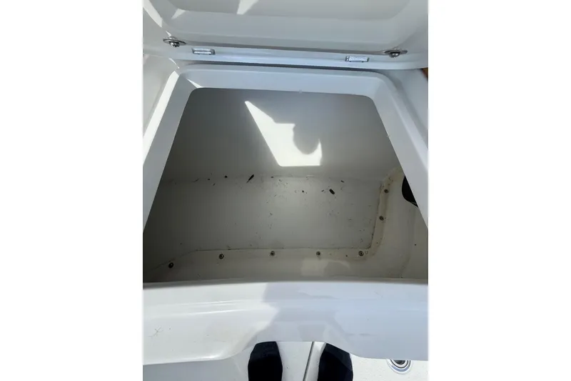 Slide: The Image of Open storage compartment on 2018 Yellowfin 32 Offshore boat, showing interior space. - 42