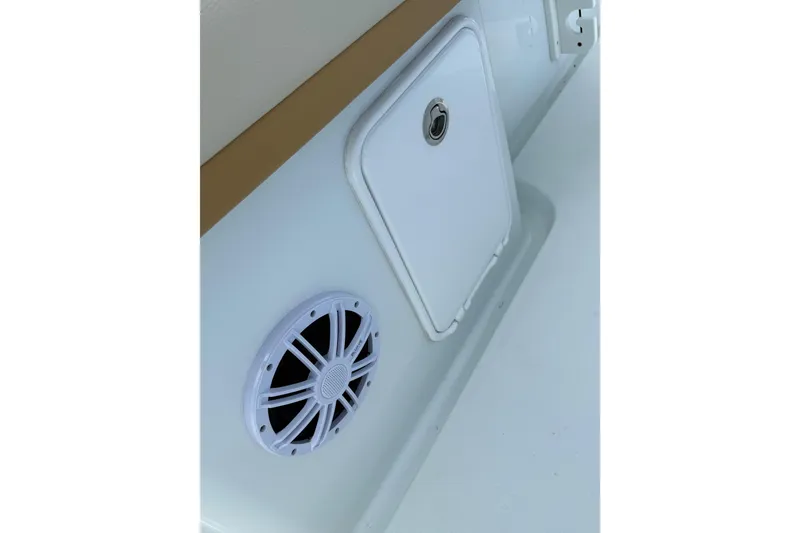 Slide: The Image of 2018 Yellowfin 32 Offshore boat interior with speaker and storage compartment. - 55