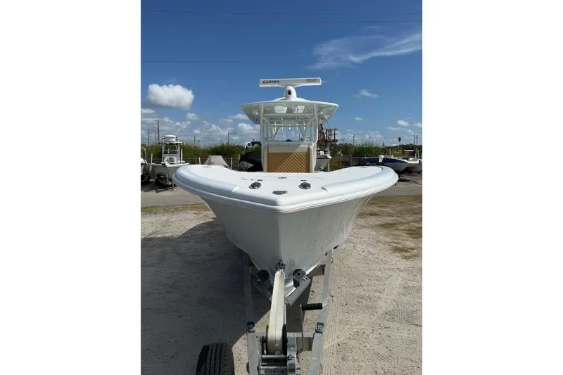 Slide: The Image of 2018 Yellowfin 32 Offshore boat on trailer under blue sky. - 6