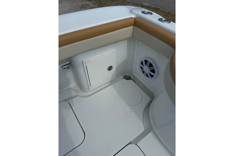 Slide: The Image of 2018 Yellowfin 32 Offshore boat interior with storage compartment and speaker. - 61
