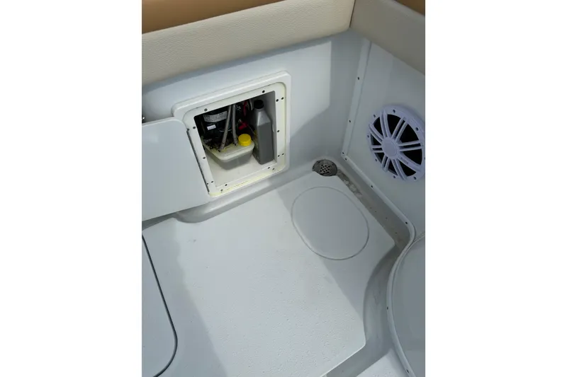Slide: The Image of 2018 Yellowfin 32 Offshore boat interior with storage compartment and speaker. - 62