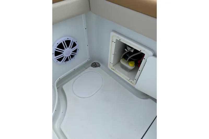 Slide: The Image of 2018 Yellowfin 32 Offshore boat interior with speaker and storage compartment. - 64