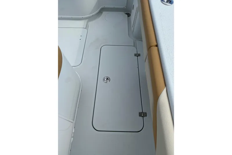 Slide: The Image of 2018 Yellowfin 32 Offshore boat deck with storage compartment and cushioned seating. - 65