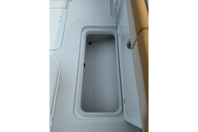 Slide: The Image of Open storage compartment on 2018 Yellowfin 32 Offshore boat deck. - 66