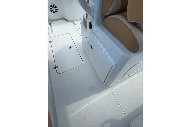 Slide: The Image of 2018 Yellowfin 32 Offshore boat interior with white deck and tan seating. - 72