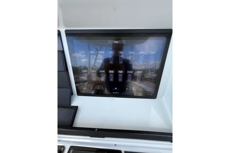 Slide: The Image of 2018 Yellowfin 32 Offshore boat touchscreen control panel display. - 76