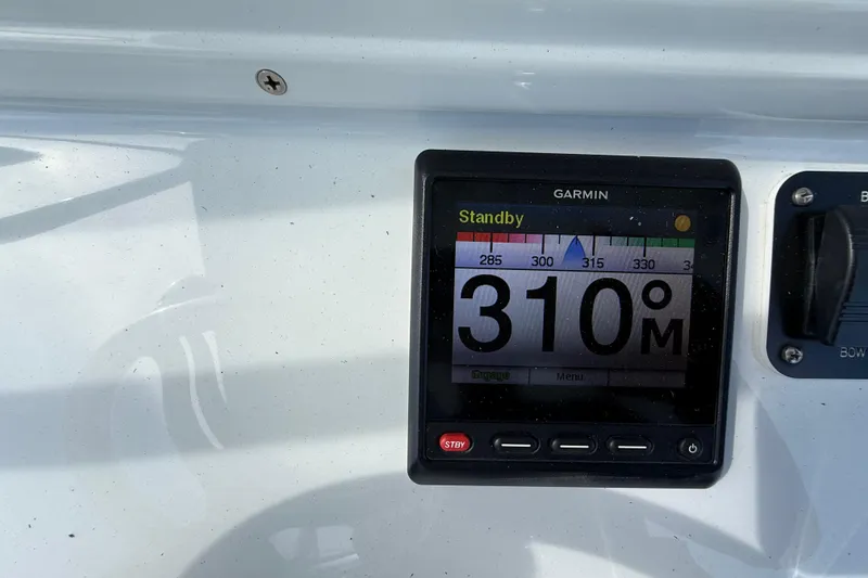 Slide: The Image of Garmin navigation display on 2018 Yellowfin 32 Offshore boat showing 310-degree heading. - 77