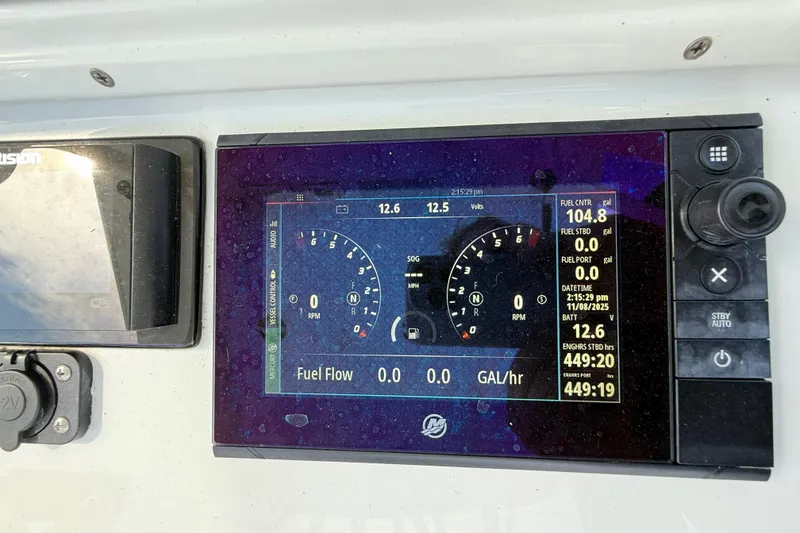 Slide: The Image of Dashboard of a 2018 Yellowfin 32 Offshore boat showing fuel and engine data. - 79