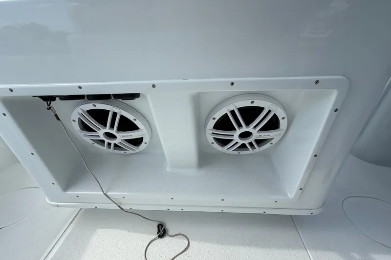 Slide: The Image of Speakers on a 2018 Yellowfin 32 Offshore boat, featuring a sleek white design. - 82