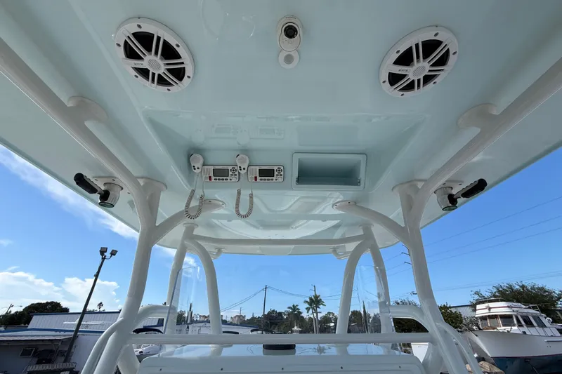 Slide: The Image of 2018 Yellowfin 32 Offshore boat console with speakers and communication devices. - 83