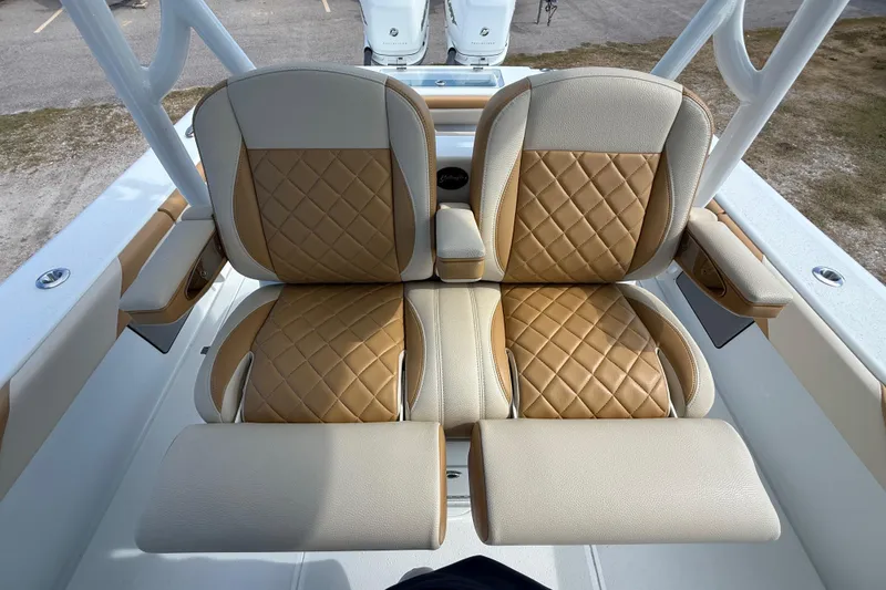 Slide: The Image of 2018 Yellowfin 32 Offshore boat seats with tan diamond-pattern upholstery. - 85