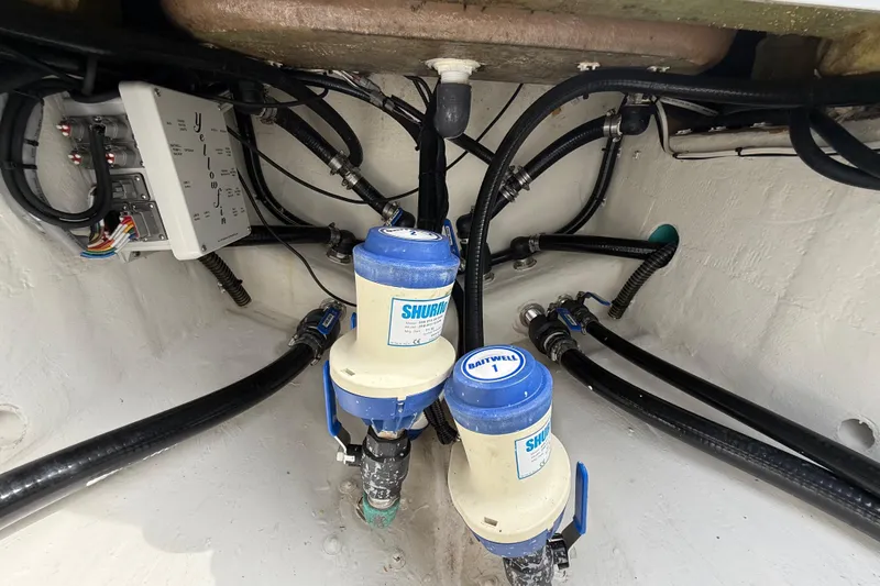 Slide: The Image of 2018 Yellowfin 32 Offshore boat wiring and plumbing system close-up. - 88