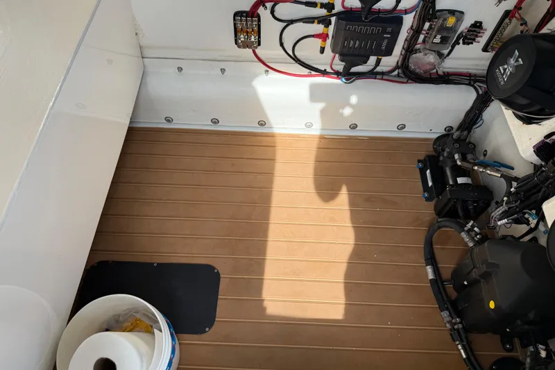 Slide: The Image of 2018 Yellowfin 32 Offshore boat interior with wiring and equipment. - 89