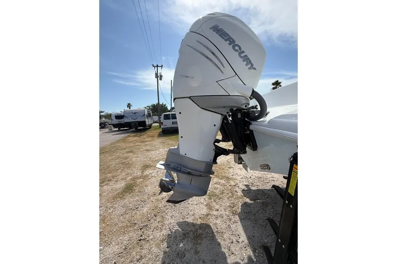 Slide: The Image of 2018 Yellowfin 32 Offshore with Mercury outboard motor in a sunny outdoor setting. - 9