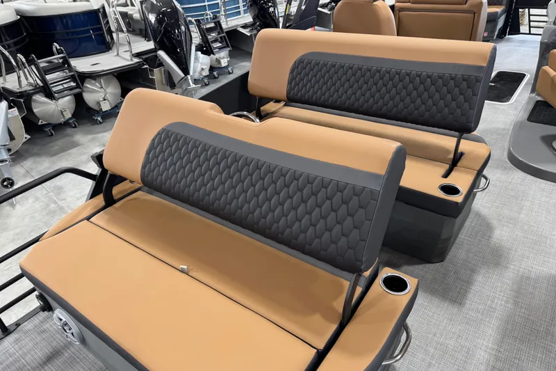 Slide: The Image of 2026 Sylvan L5 DLZ Platinum boat seats with tan and gray upholstery. - 10