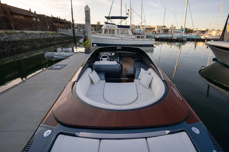 Slide: The Image of 2026 Riva 33' Aquariva Special luxury boat docked in marina, elegant design. - 17