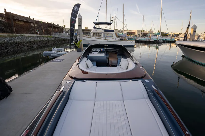 Slide: The Image of 2026 Riva 33' Aquariva Special luxury yacht docked at marina, showcasing sleek design. - 18