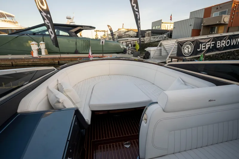 Slide: The Image of Luxurious 2026 Riva 33' Aquariva Special yacht with elegant white seating at dock. - 20