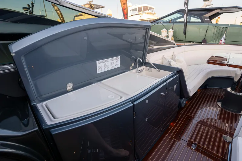 Slide: The Image of Luxurious interior of 2026 Riva 33' Aquariva Special yacht with sleek design and seating area. - 21