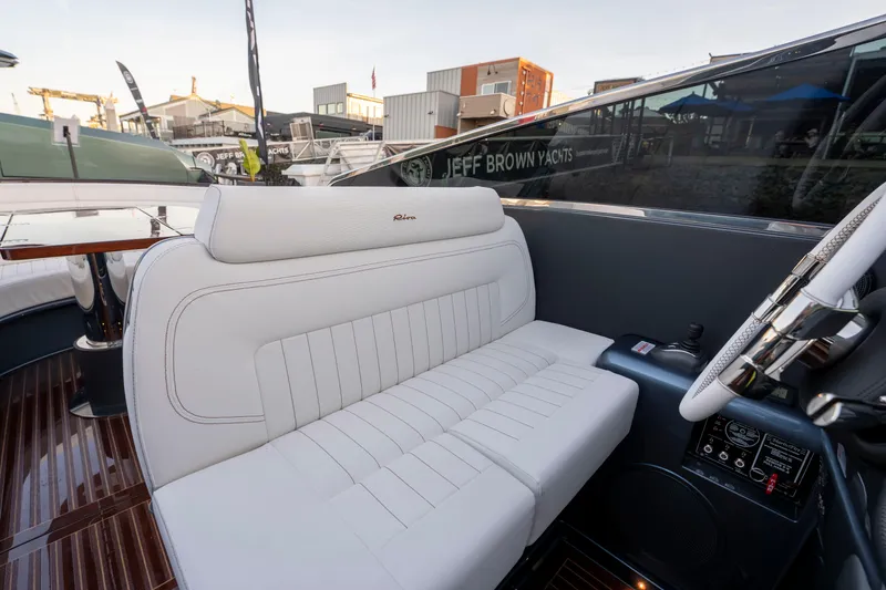 Slide: The Image of Luxurious interior of 2026 Riva 33' Aquariva Special yacht with white leather seating. - 23