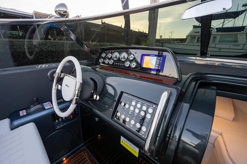 Slide: The Image of Cockpit of 2026 Riva 33' Aquariva Special with modern controls and navigation system. - 25