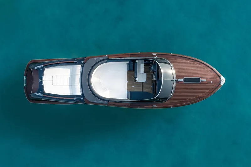 Slide: The Image of Overhead view of 2026 Riva 33 Aquariva Special luxury yacht on turquoise water. - 5