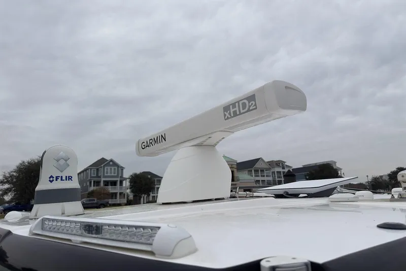 Slide: The Image of 2023 Caymas 341 CC boat with Garmin xHD2 radar and FLIR system under cloudy sky. - 20