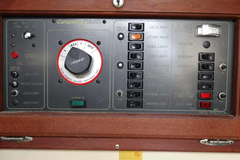 Slide: The Image of Control panel of a 1988 Catalina MKII yacht with switches and dials. - 16