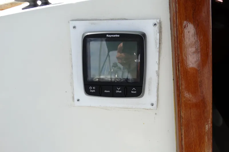 Slide: The Image of Raymarine display on 1988 Catalina MKll sailboat, showing depth and alarm controls. - 24