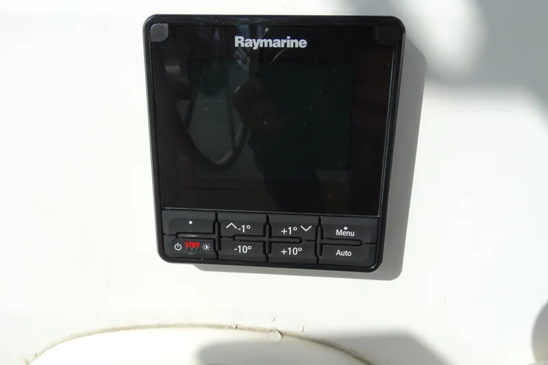Slide: The Image of Raymarine control panel on 1988 Catalina MKll sailboat, featuring navigation buttons. - 25