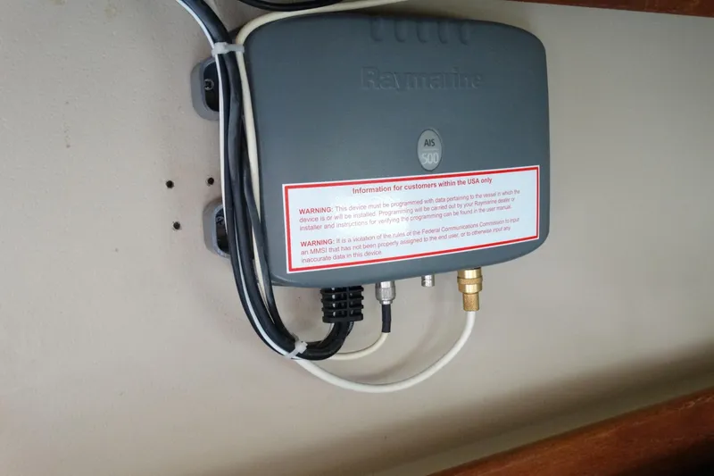 Slide: The Image of Raymarine AIS 500 device installed on 1988 Catalina MKll boat with warning label. - 27