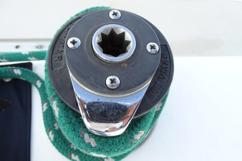 Slide: The Image of Winch on 1988 Catalina MKll sailboat with green rope, close-up view. - 31