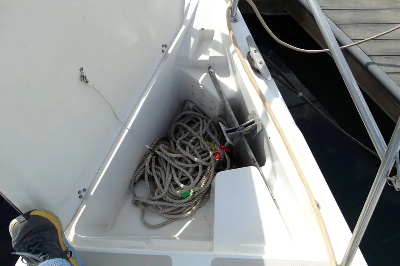 Slide: The Image of Anchor locker of 1988 Catalina MKII sailboat with coiled rope and anchor. - 33