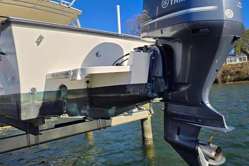 Slide: The Image of 2015 May-Craft 2550 Pilot XL with Yamaha outboard motor on a lift. - 13