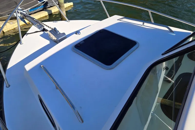 Slide: The Image of 2015 May-Craft 2550 Pilot XL boat deck with hatch and railing. - 20